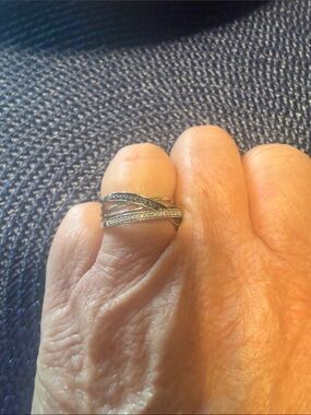 Elegant Sterling Silver-Tone Crisscross Ring with black and white diamonds.